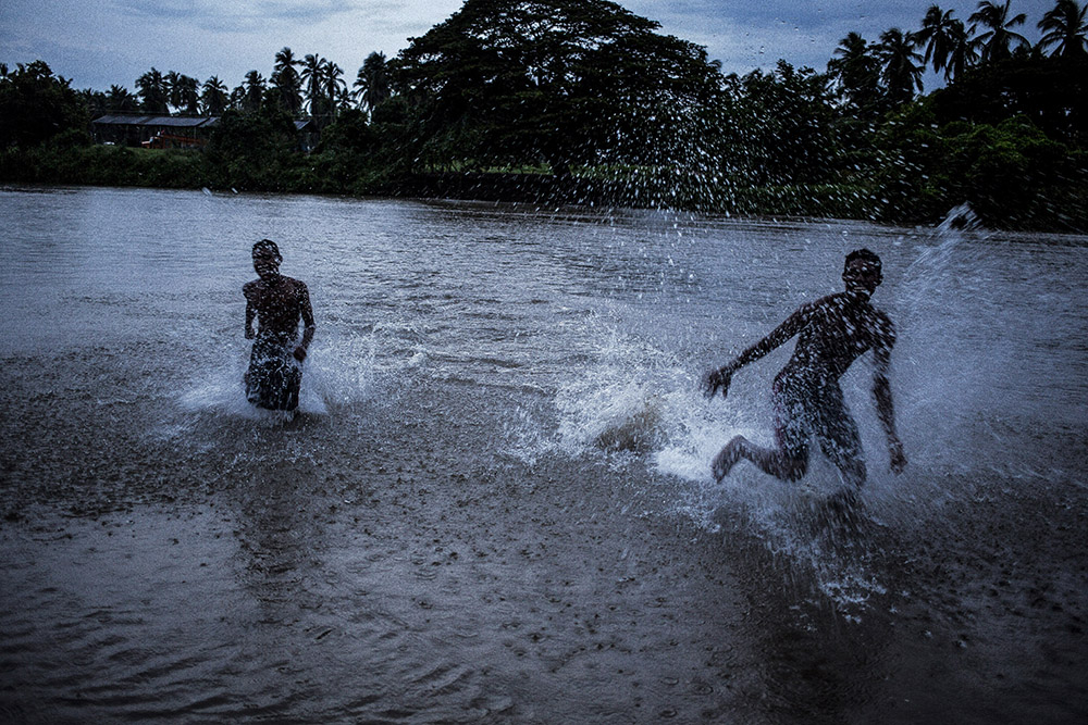 Jose Maria Morelos, Oaxaca, August 22nd, 2014. A bar in a late afternoon with rain in Santa Maria Xicometepec, also known as La Boquilla, where the great majority of residents are Afromexicans. For years Mexico's black communities have lived isolated and often forgotten, but still practicing some of the traditions of their African descendants, largely slaves and escaped slaves who fled into remote hills in southern Mexico. But a new effort is underway to officially count the population in the next national census in February, what advocates call a key step in bringing recognition to the communities and making the country more aware of people from what is commonly called "the third root." (after European and indigenous roots). Photograph by © Adriana Zehbrauskas